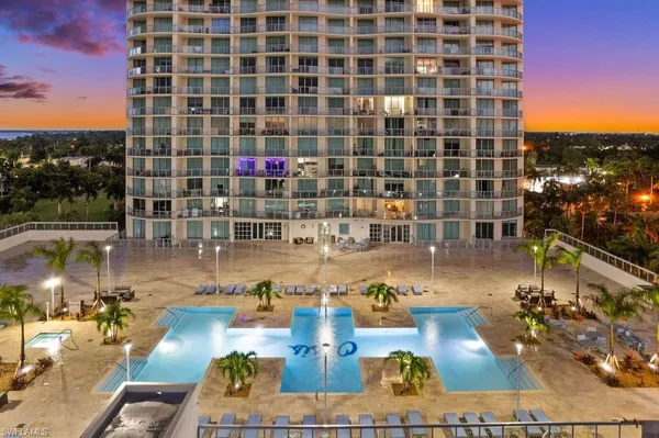 a view of swimming pool with outdoor seating