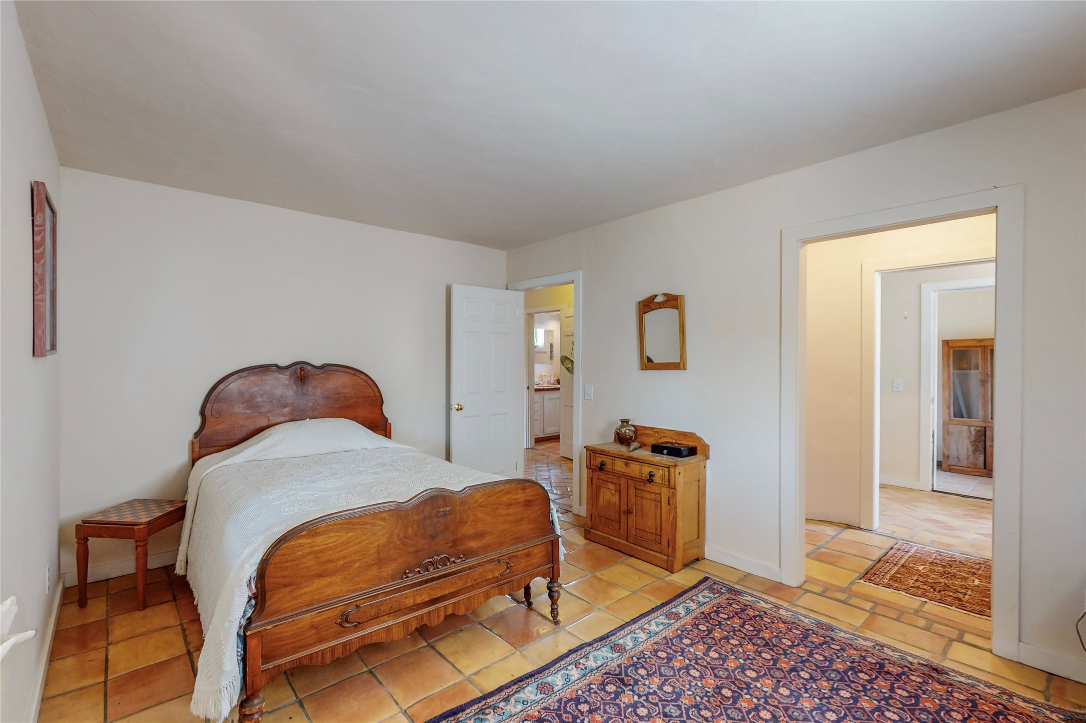 175 Hidden Valley Ranch Road Ilfeld, NM 87538 - Photo 32 of 43 Downstairs bedroom with view to full bath