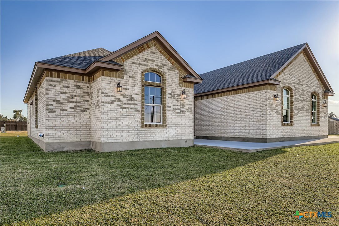 222 Arosa Drive Elgin, TX 78621 - Photo 14 of 40 a front view of a house with a yard