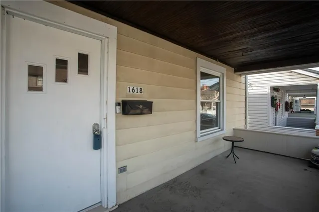 a bathroom with a tub and a window
