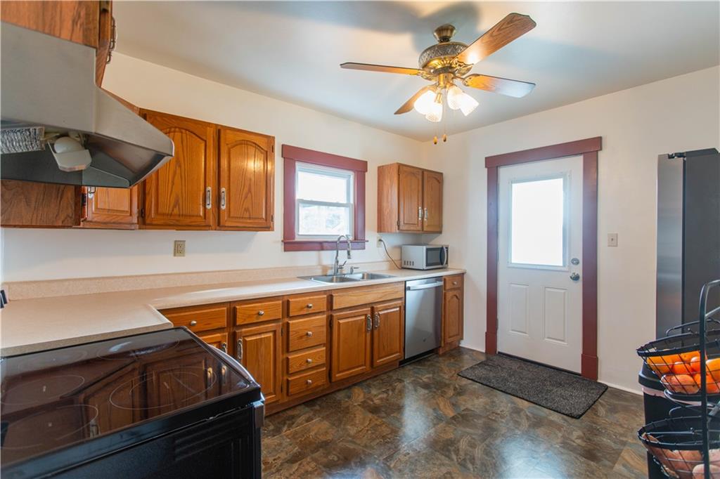 1618 North 3rd Street New Brighton, PA 15066 - Photo 3 of 28 a kitchen that has a sink stainless steel appliances a window and a counter top space