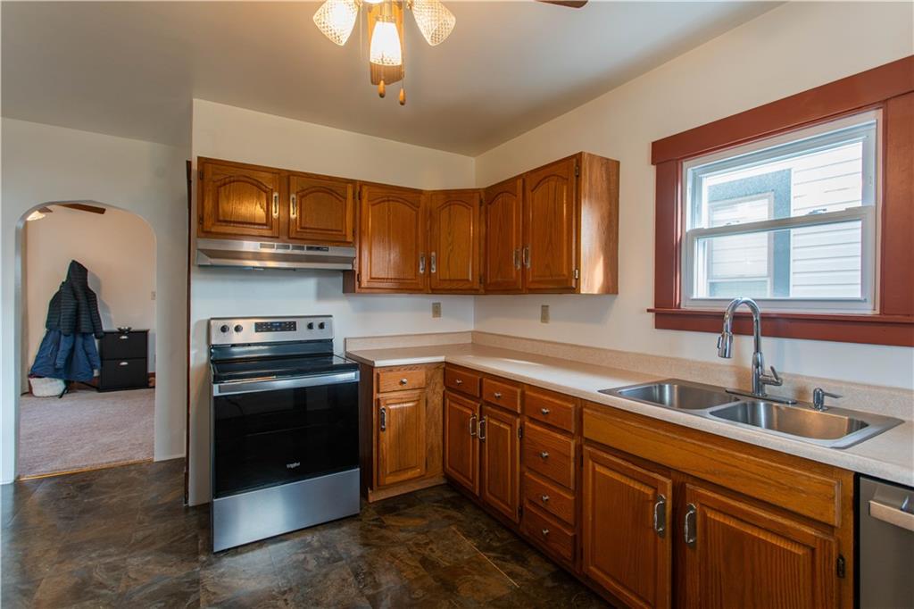 1618 North 3rd Street New Brighton, PA 15066 - Photo 6 of 28 a kitchen with stainless steel appliances granite countertop a sink and a stove