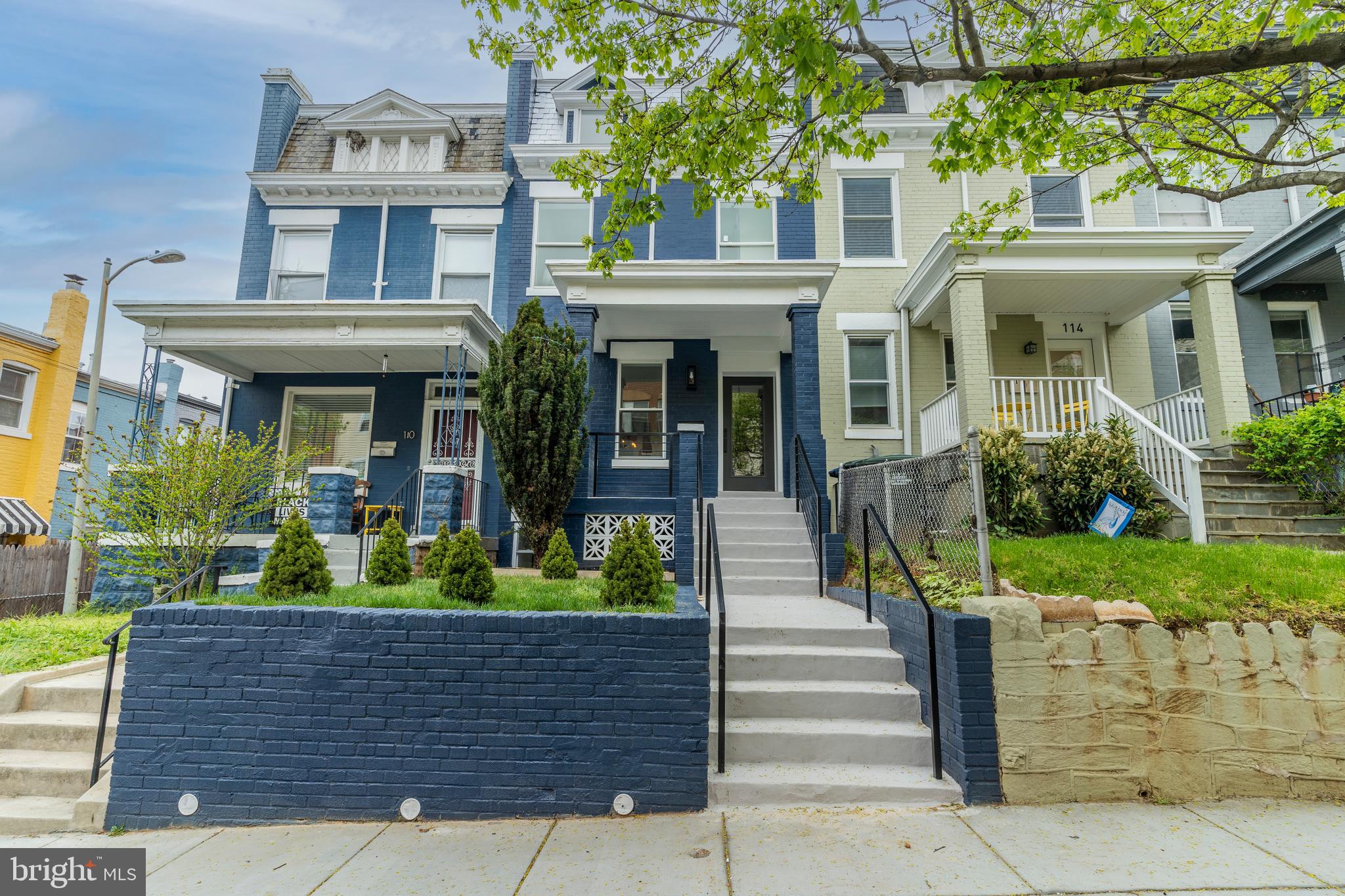 112 Todd Place Northeast Washington, DC 20002 - Photo 2 of 73 a front view of a house with plants and garden
