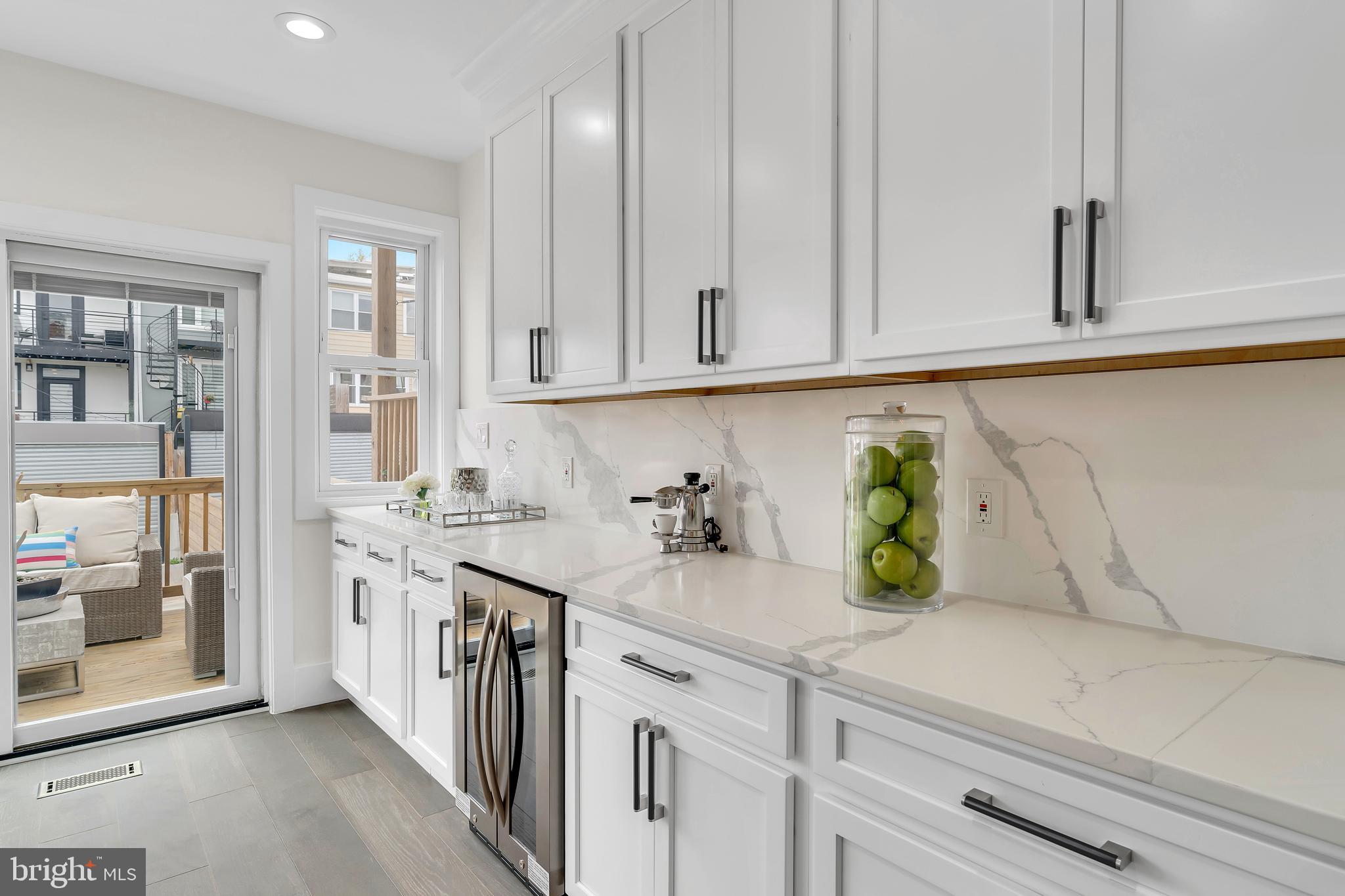 112 Todd Place Northeast Washington, DC 20002 - Photo 17 of 73 a kitchen with stainless steel appliances white cabinets and a counter top