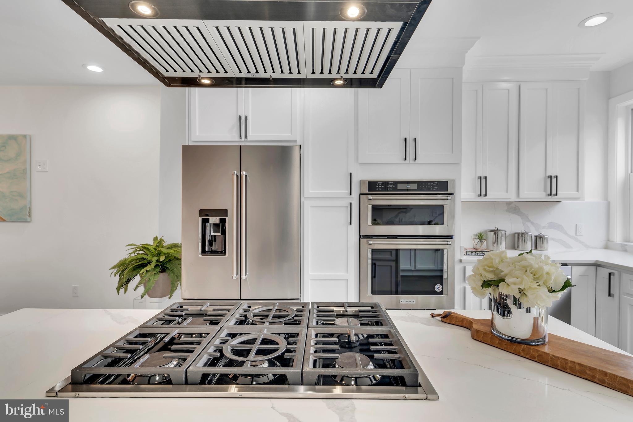 112 Todd Place Northeast Washington, DC 20002 - Photo 20 of 73 a kitchen with a stove a microwave a refrigerator and cabinets