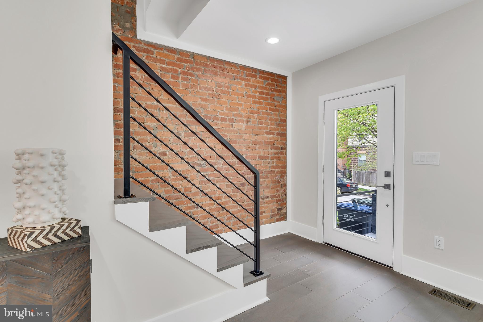 112 Todd Place Northeast Washington, DC 20002 - Photo 4 of 73 a view of entryway with wooden floor and a front door