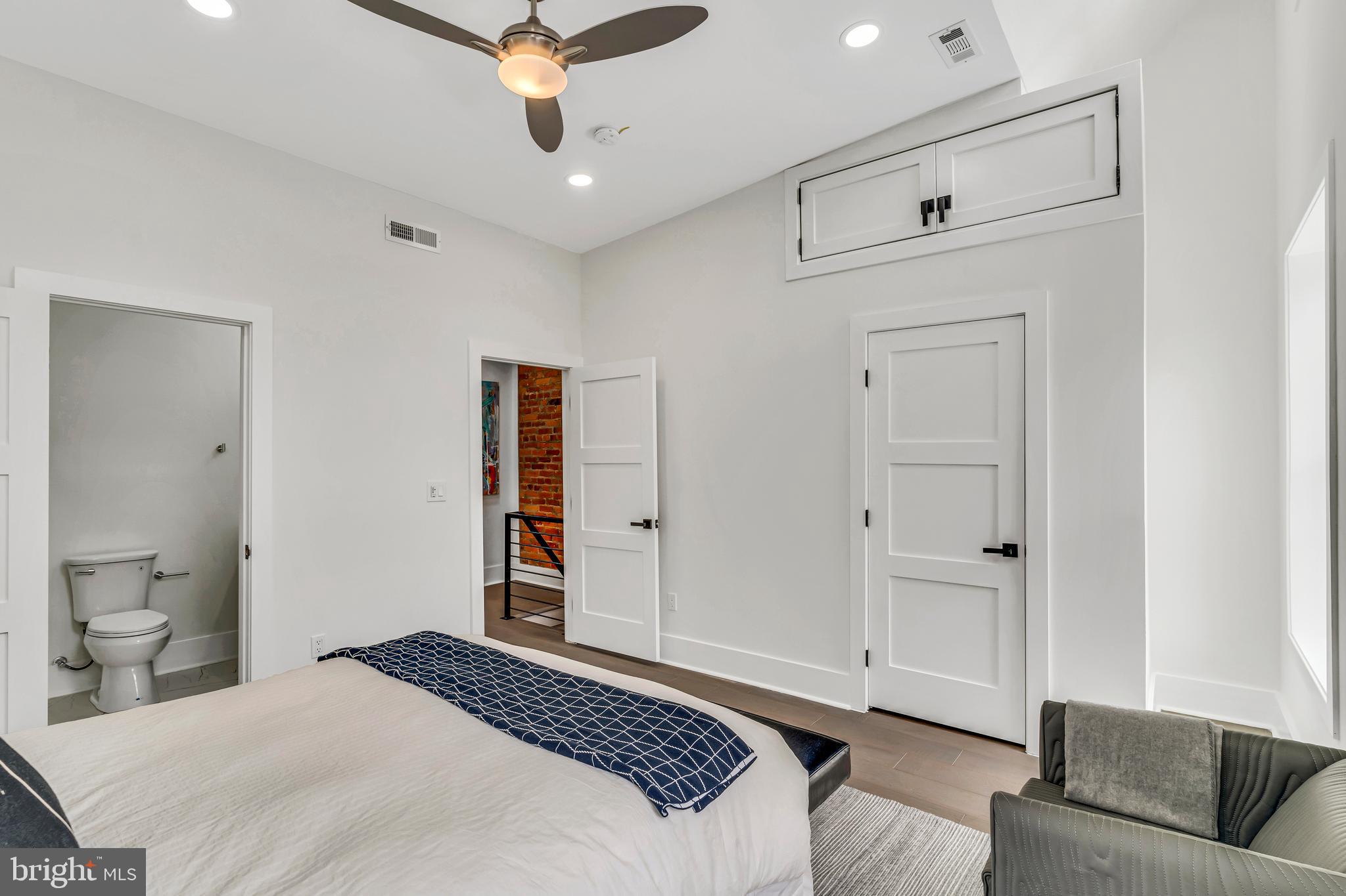 112 Todd Place Northeast Washington, DC 20002 - Photo 35 of 73 a bedroom with a large bed and ceiling fan