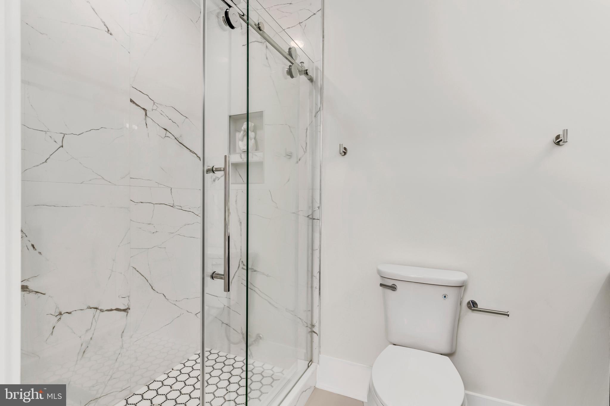 112 Todd Place Northeast Washington, DC 20002 - Photo 36 of 73 a white toilet sitting next to a bathroom