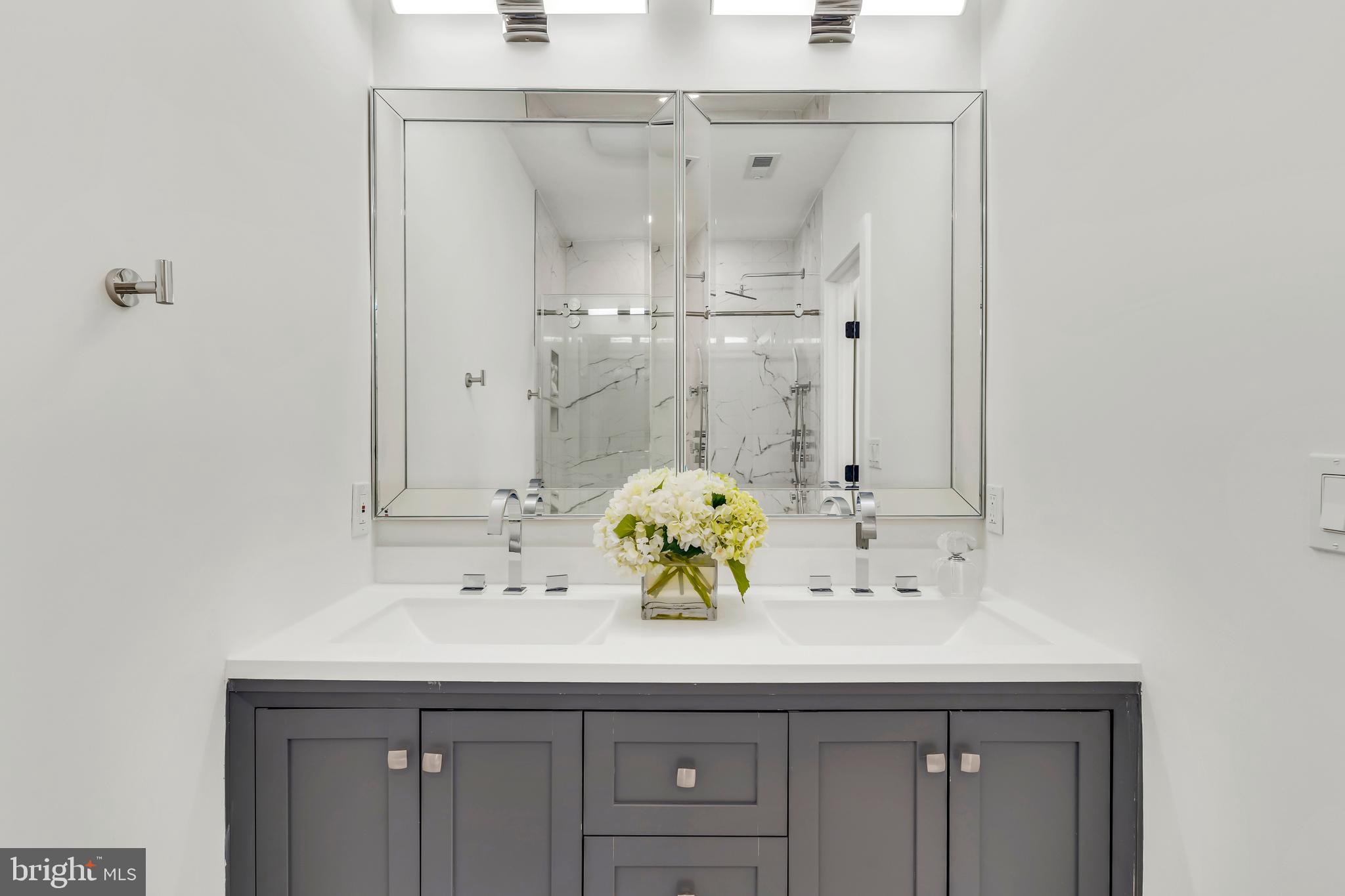 112 Todd Place Northeast Washington, DC 20002 - Photo 38 of 73 a bathroom with a sink and mirror