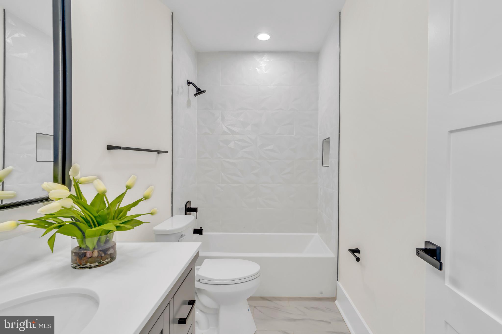 112 Todd Place Northeast Washington, DC 20002 - Photo 40 of 73 a bathroom with a sink a toilet a tub and shower