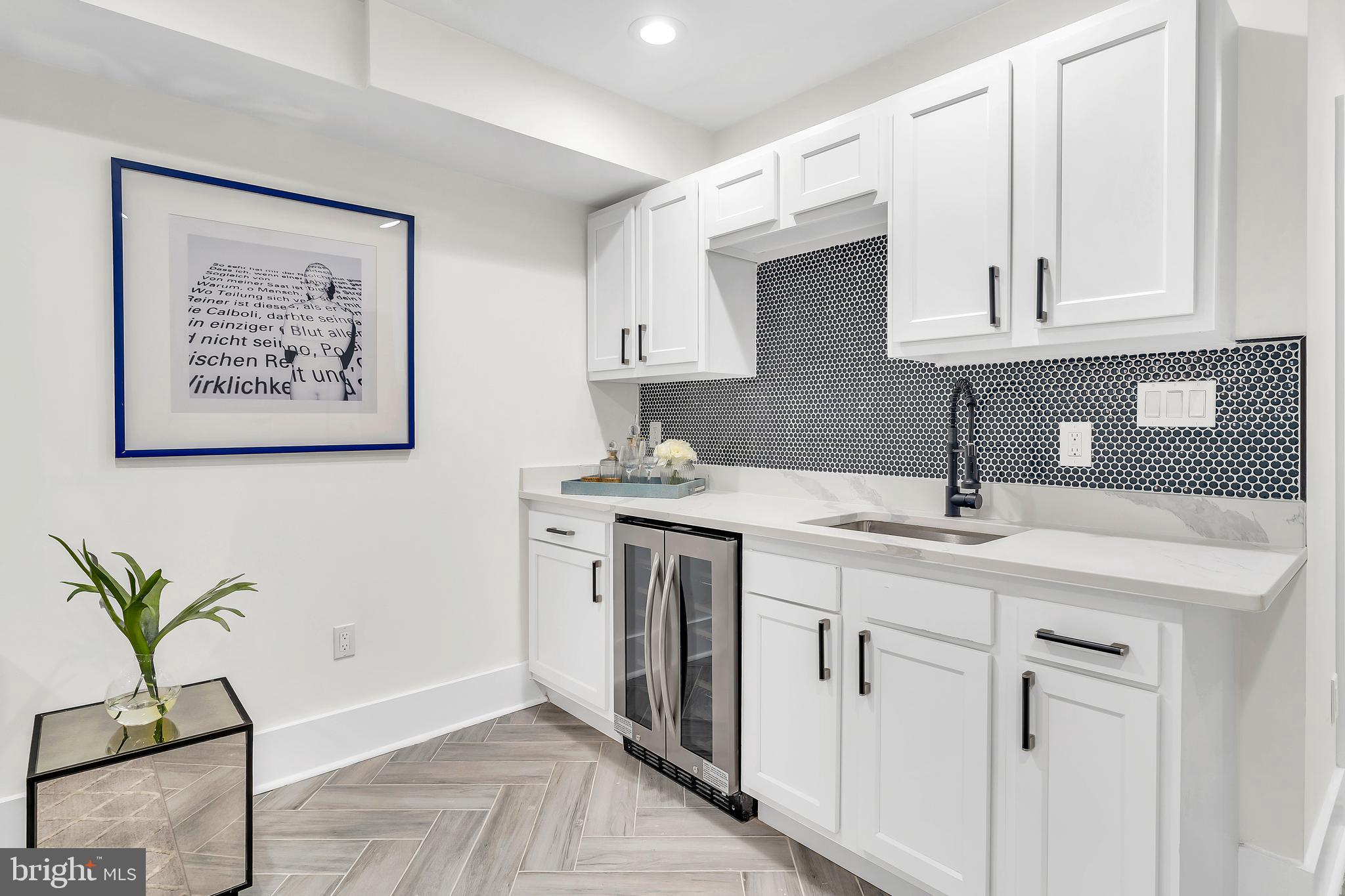 112 Todd Place Northeast Washington, DC 20002 - Photo 61 of 73 a kitchen with stainless steel appliances white cabinets a sink and a stove