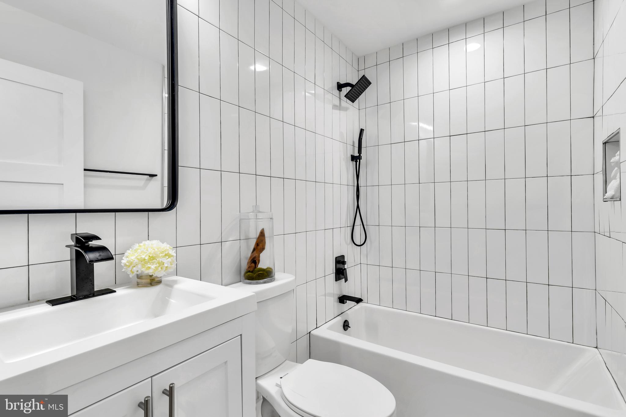 112 Todd Place Northeast Washington, DC 20002 - Photo 65 of 73 a bathroom with a sink toilet and shower