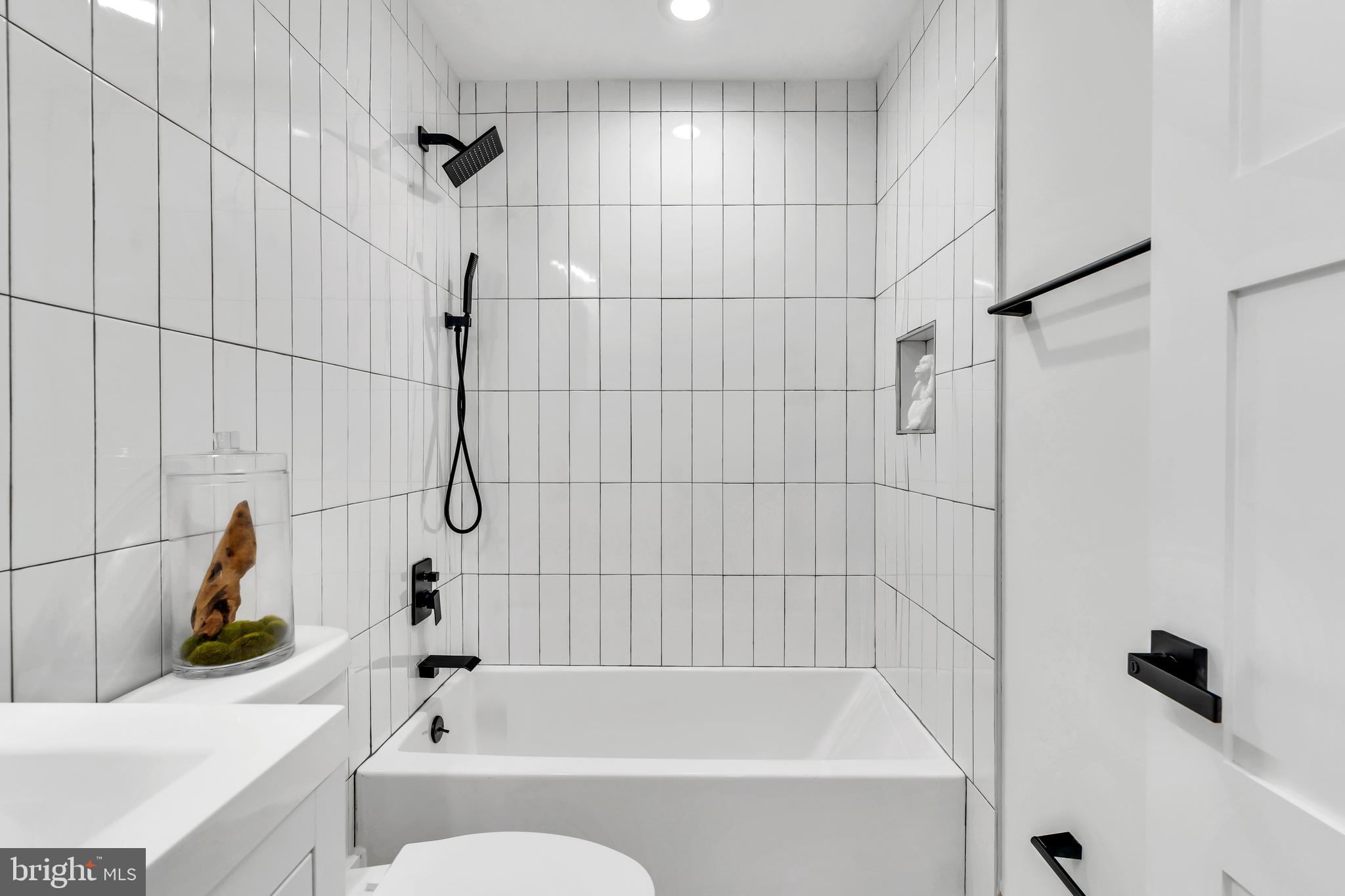 112 Todd Place Northeast Washington, DC 20002 - Photo 66 of 73 a bathroom with a bathtub and a shower