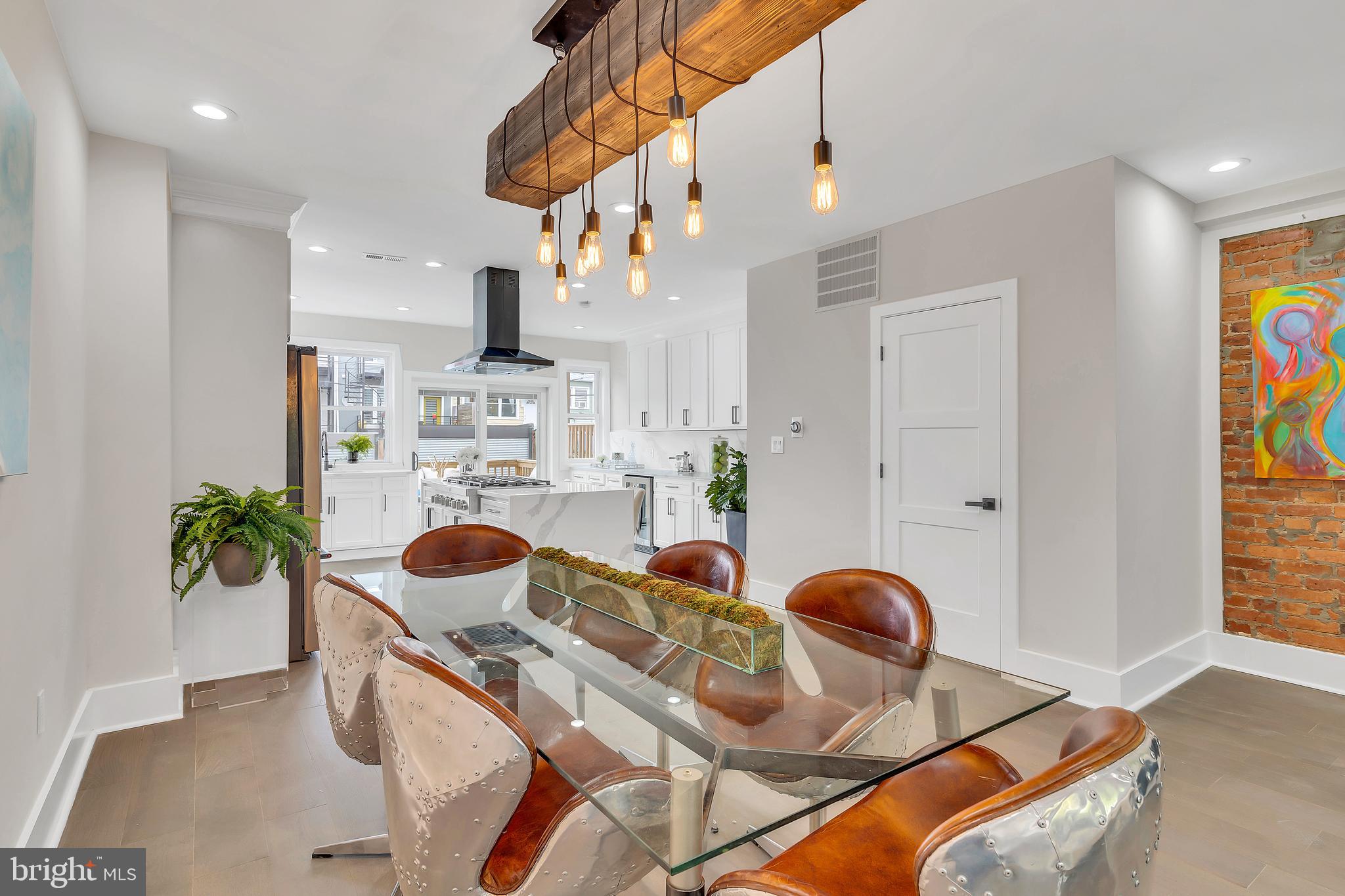 112 Todd Place Northeast Washington, DC 20002 - Photo 9 of 73 a kitchen with stainless steel appliances granite countertop a sink a stove and a wooden floors