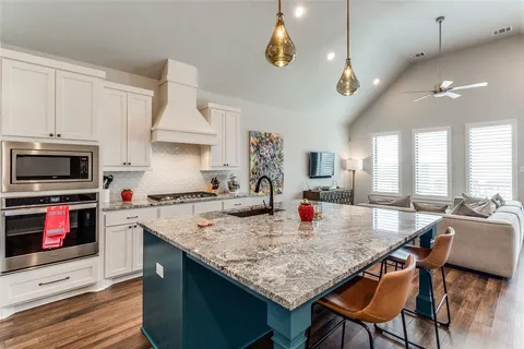 a bedroom with two beds and a window