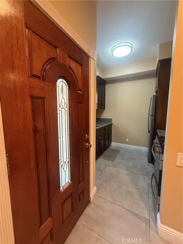 a kitchen with granite countertop a stove and a sink
