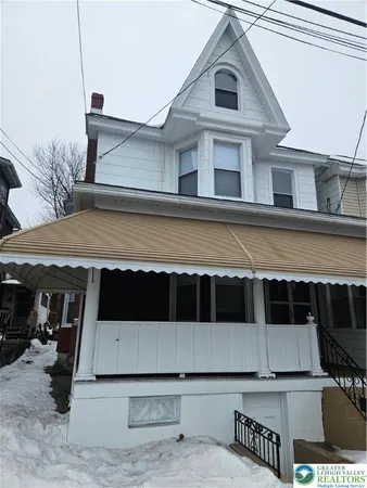 a front view of a house with a balcony