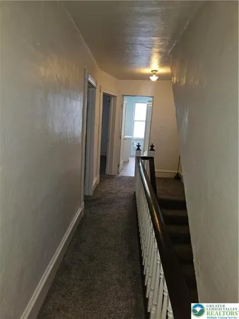 a view of a hallway with windows