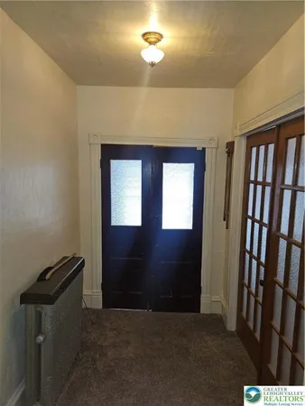 a view of empty room with windows