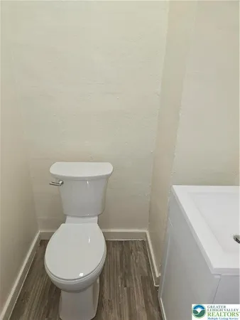a bathroom with a toilet and a sink
