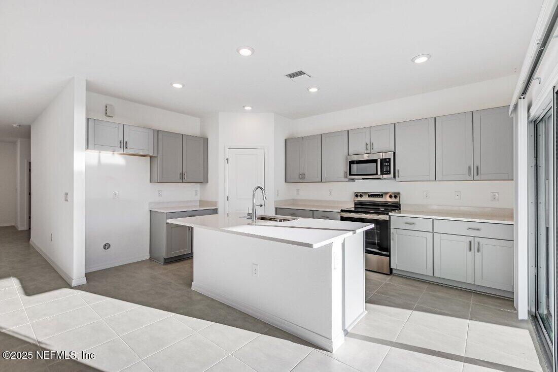 8525 Lilias Circle Jacksonville, FL 32219 - Photo 2 of 32 hj-fl-jacksonville-coopers-meadow-ficus-