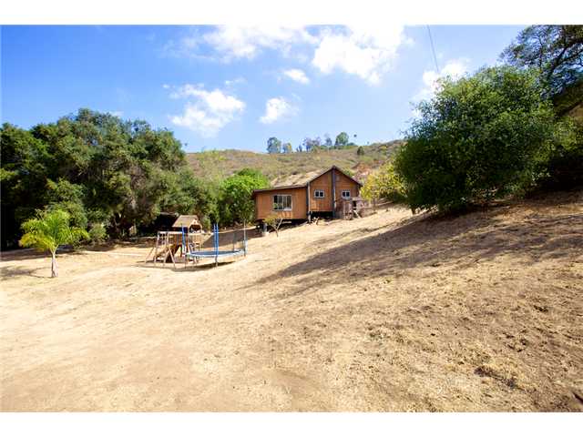 9121 Harmony Grove Road Escondido, CA 92029 - Photo 21 of 25 Barn building and cleared area