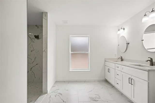 a view of a room with wooden floor and window