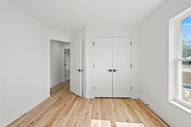 a bathroom with a double vanity sink and a toilet