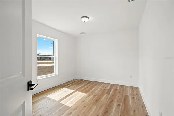 a view of a livingroom with wooden floor