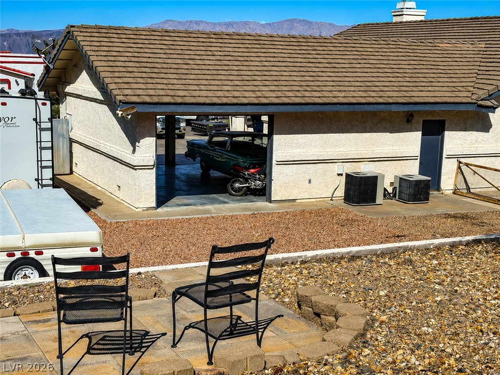 524 Swallow Cove Boulder City, NV 89005 - Photo 56 of 58 A versatile property featuring a large garage and ample outdoor space, perfect for hobbies or storage.