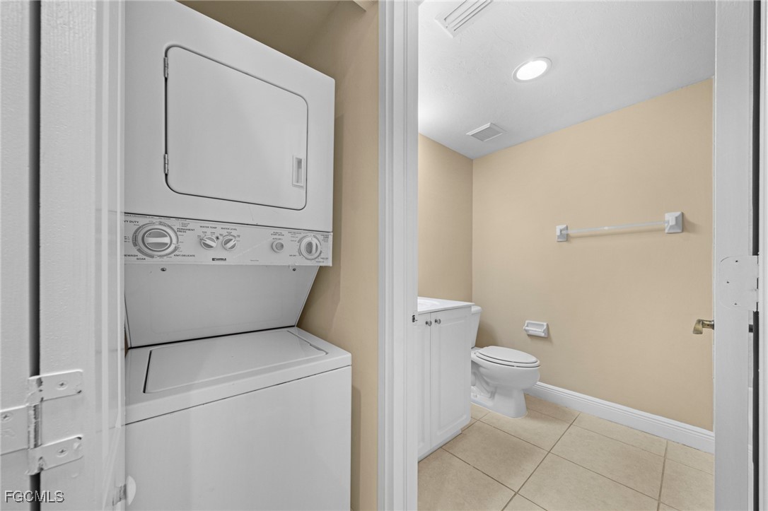 4160 Castilla Circle, Unit 204 Fort Myers, FL 33916 - Photo 15 of 37 a view of bathroom with a toilet a sink and a mirror