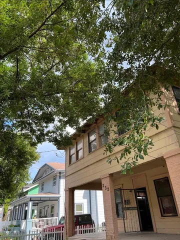 a view of a building with a tree