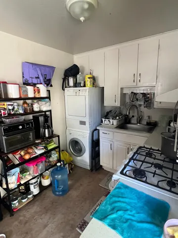 a kitchen with a refrigerator and a stove