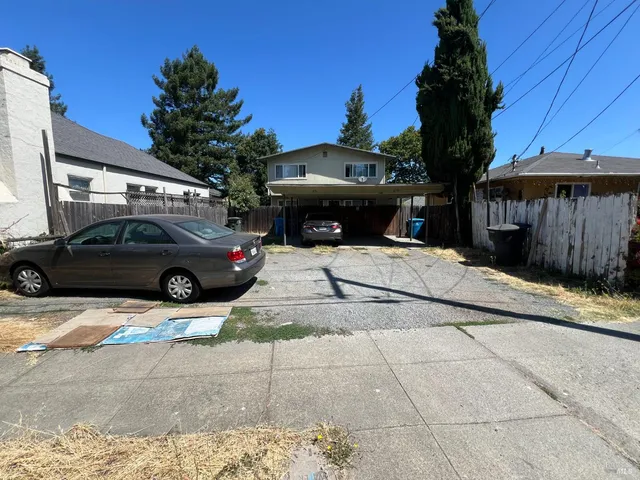 a view of a car parked in front of a building