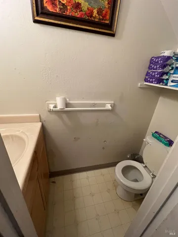 a bathroom with a toilet and a sink