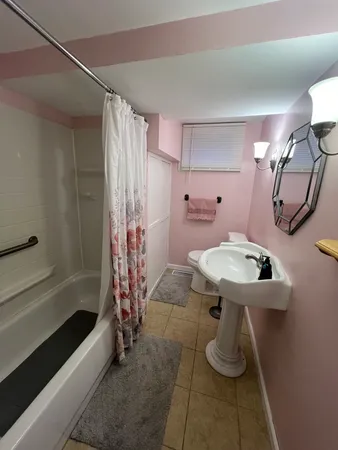 a bathroom with a sink and mirror