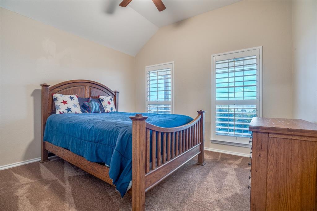 108 High Meadows Court Decatur, TX 76234 - Photo 15 of 29 a bedroom with a bed and a window