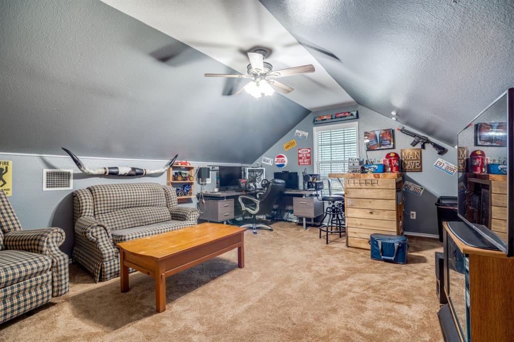108 High Meadows Court Decatur, TX 76234 - Photo 18 of 29 a storage room with furniture and a flat screen tv