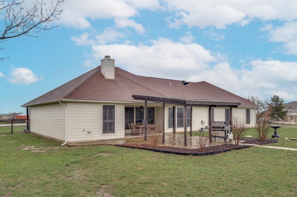 108 High Meadows Court Decatur, TX 76234 - Photo 20 of 29 a front view of a house with swimming pool having outdoor seating