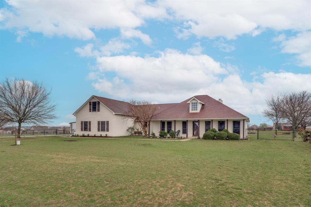 108 High Meadows Court Decatur, TX 76234 - Photo 2 of 29 a front view of a house with garden
