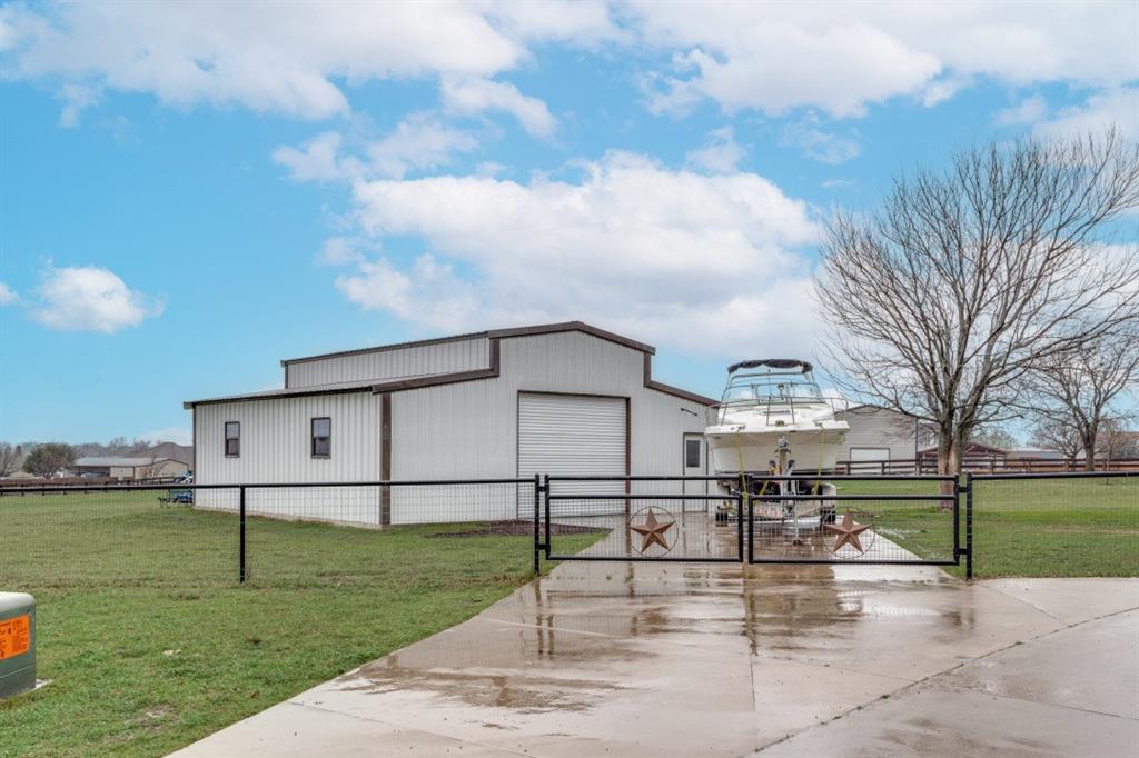108 High Meadows Court Decatur, TX 76234 - Photo 21 of 29 a view of backyard with a garden and plants