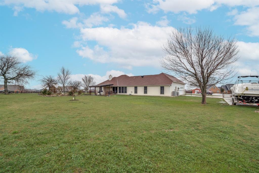 108 High Meadows Court Decatur, TX 76234 - Photo 23 of 29 a view of a house with a yard