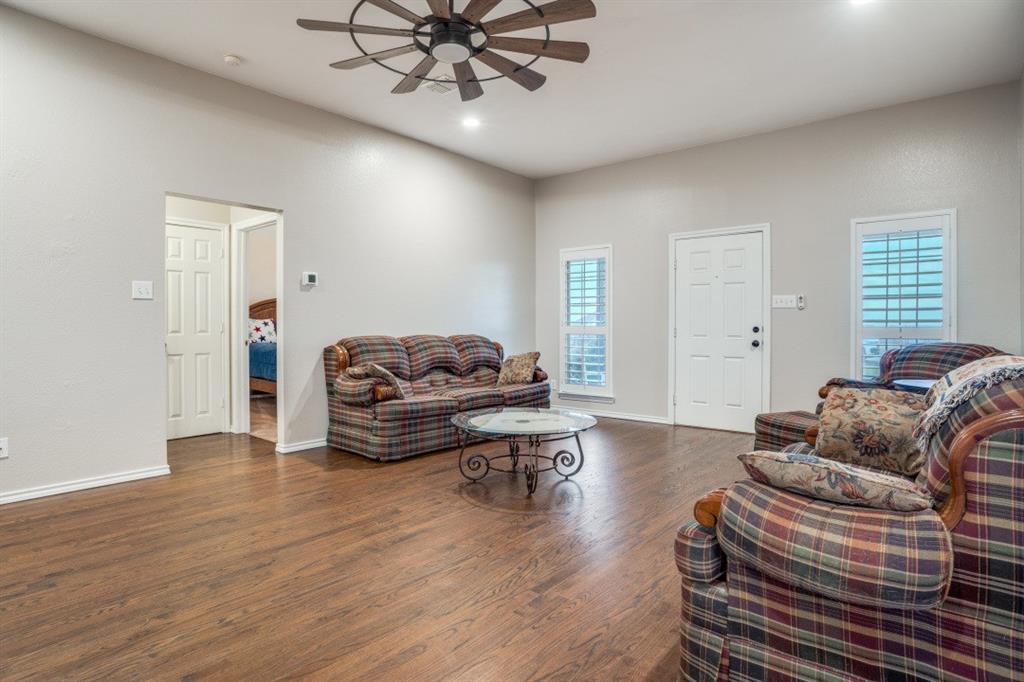 108 High Meadows Court Decatur, TX 76234 - Photo 3 of 29 a living room with furniture and a wooden floor