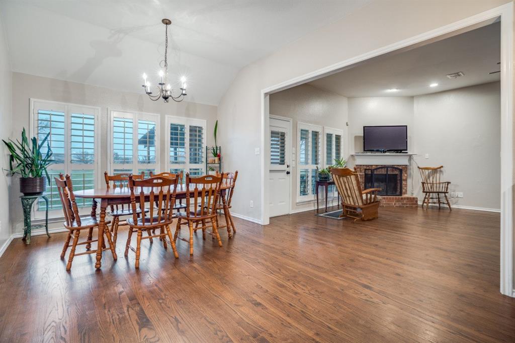 108 High Meadows Court Decatur, TX 76234 - Photo 6 of 29 a view of a dining room with furniture wooden floor and chandelier