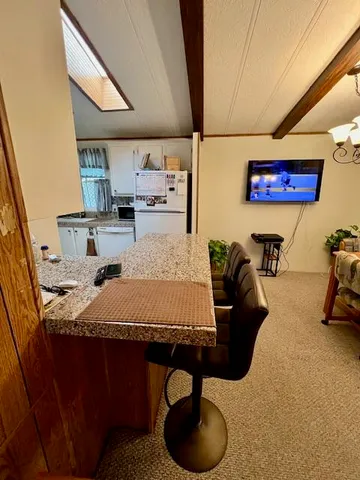 a bedroom with a bed and a chair