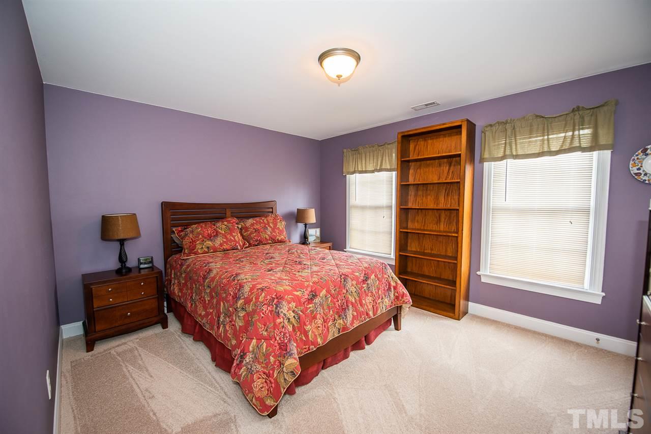 81 Rand Road Raleigh, NC 27603 - Photo 16 of 24 a bedroom with a bed and a window