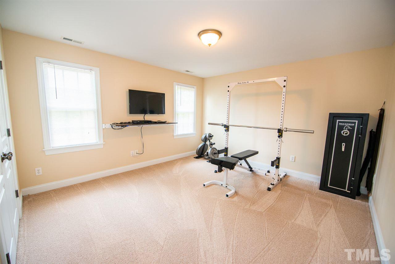 81 Rand Road Raleigh, NC 27603 - Photo 17 of 24 a view of livingroom with furniture and a flat screen tv