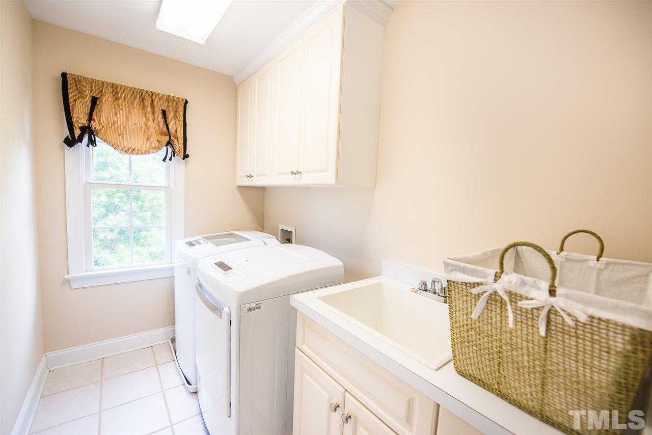 81 Rand Road Raleigh, NC 27603 - Photo 18 of 24 a bathroom with a sink and a mirror