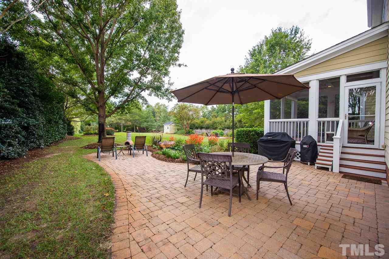 81 Rand Road Raleigh, NC 27603 - Photo 21 of 24 a view of a tables and chairs under an umbrella