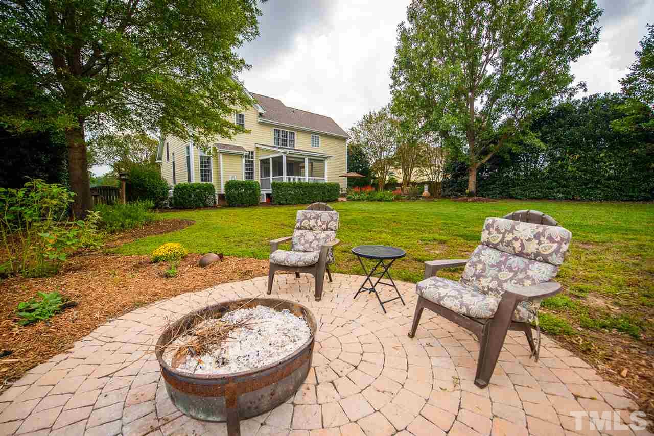 81 Rand Road Raleigh, NC 27603 - Photo 22 of 24 a view of a backyard with furniture and garden